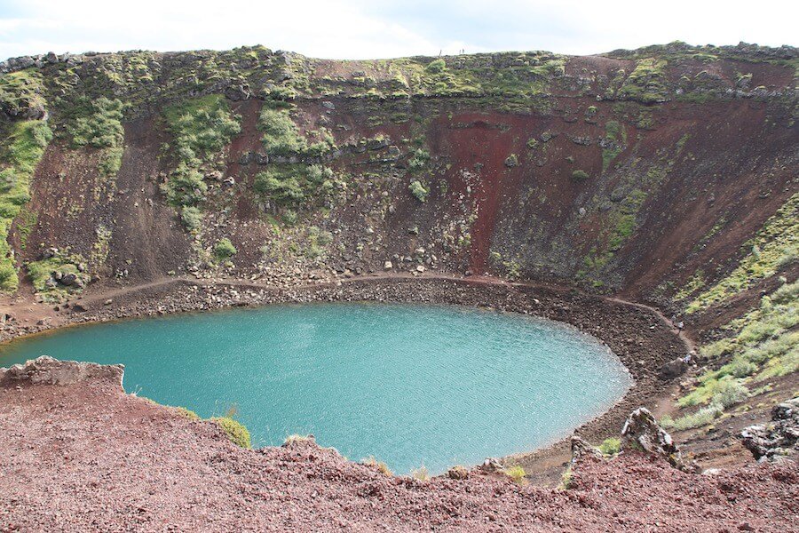 Large crater with blue water at the bottom