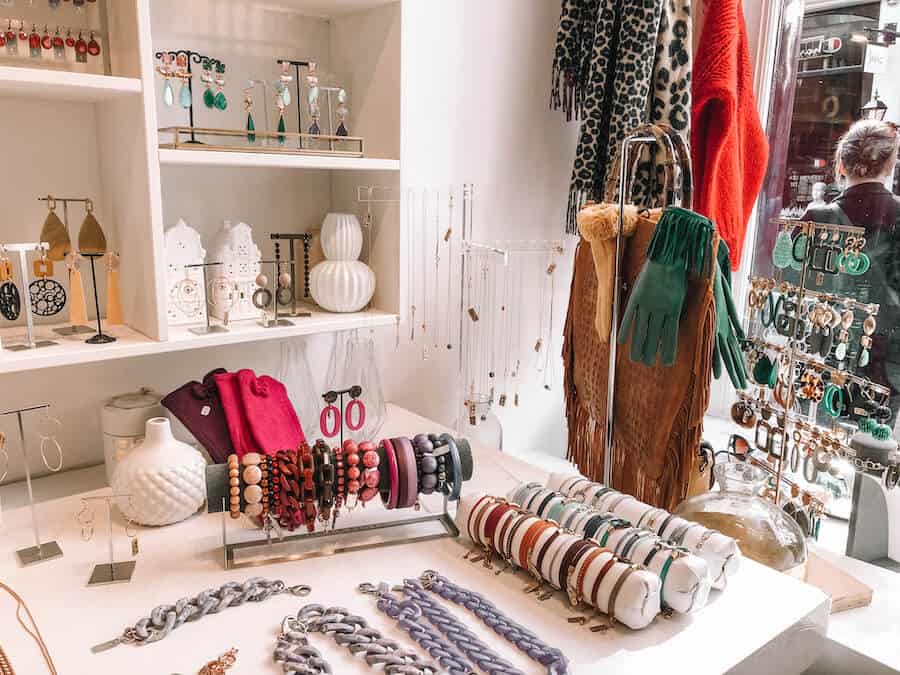 Colorful jewelry, scarfs, gloves and more inside a store in Amsterdam