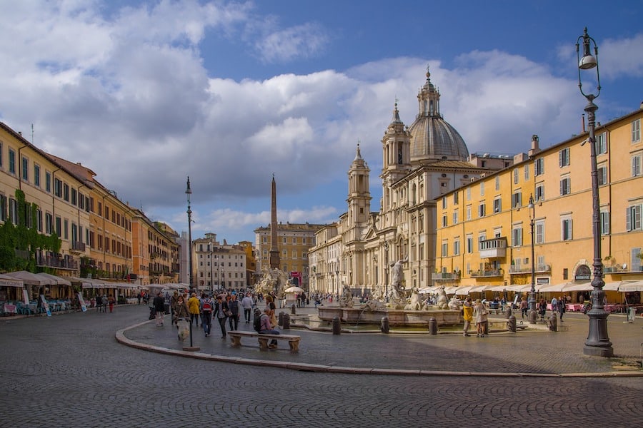 Piazza Navona square filled with people and colourful buildings 