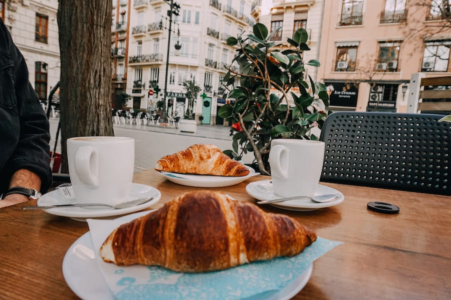 Croissants and Valencia city buildings in the background 