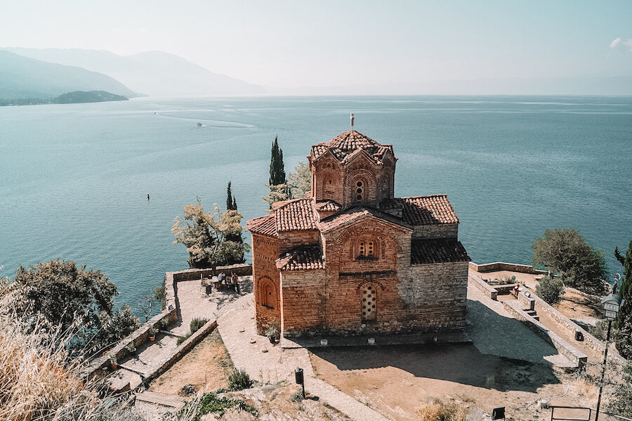 Lone church with water in the distance in the perfect balkan holiday spot Lake Ohrid