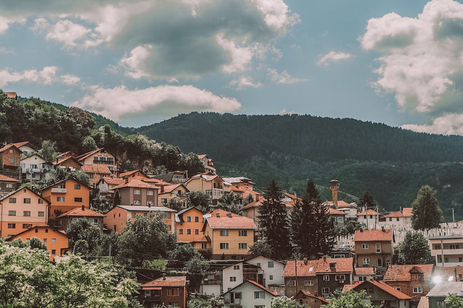 Orange buildings and green mountains in Sarajevo