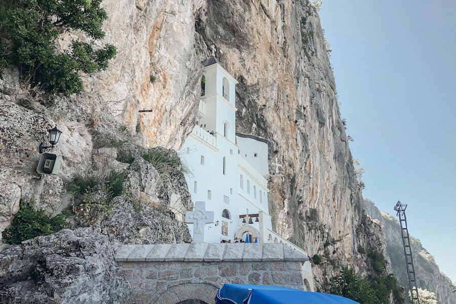 White Monastery built into the sharp cliff side - Top 10 places to visit in Montenegro