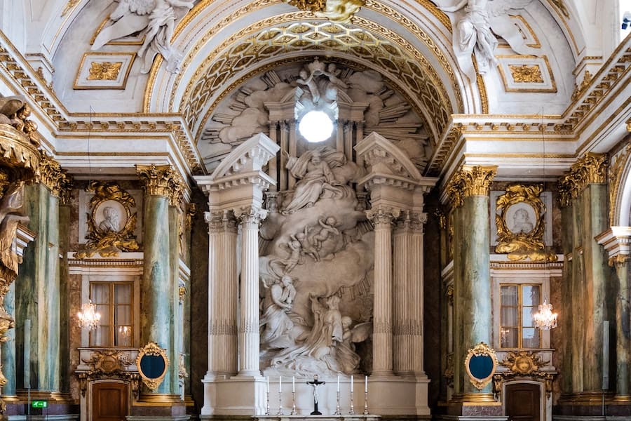 Royal Chapel interior with white marble statues and walls