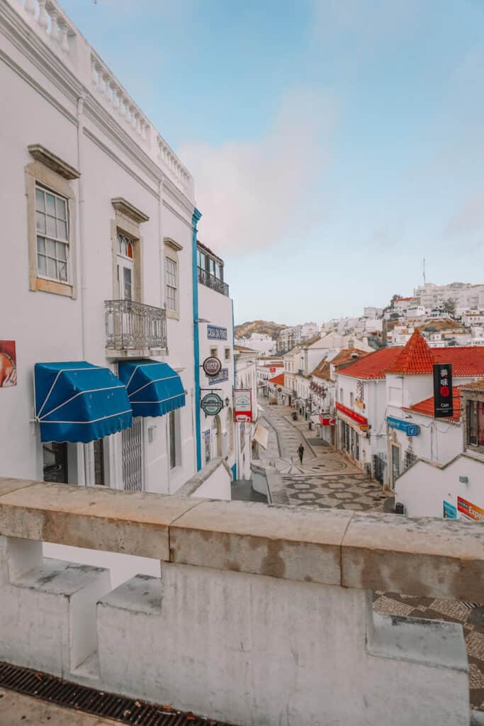 White coloured buildings on a tiled street