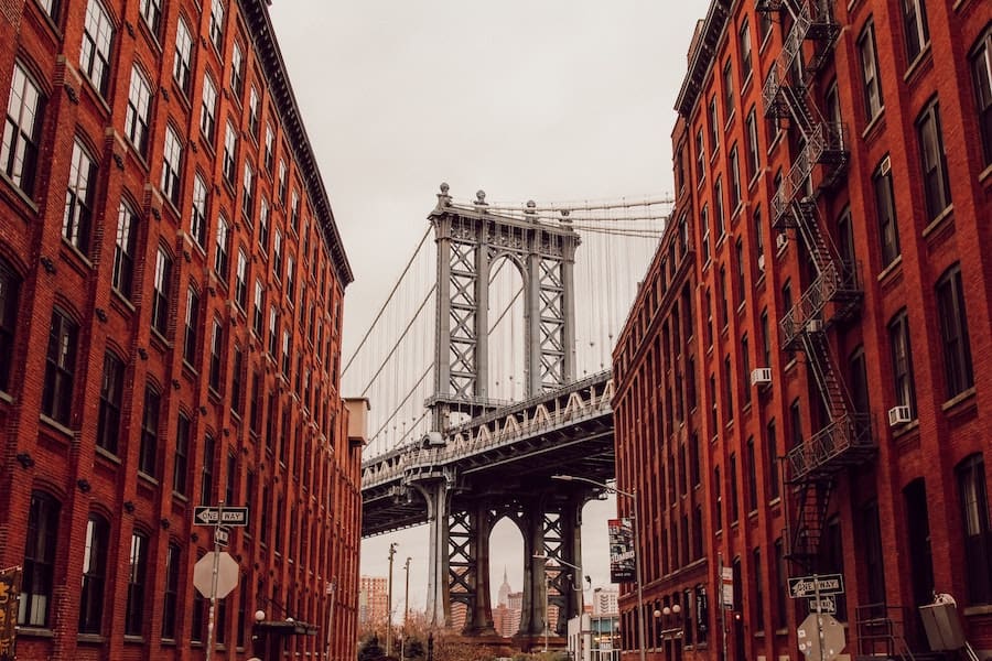 Two buildings in Brooklyn with a view of the Brooklyn Bridge