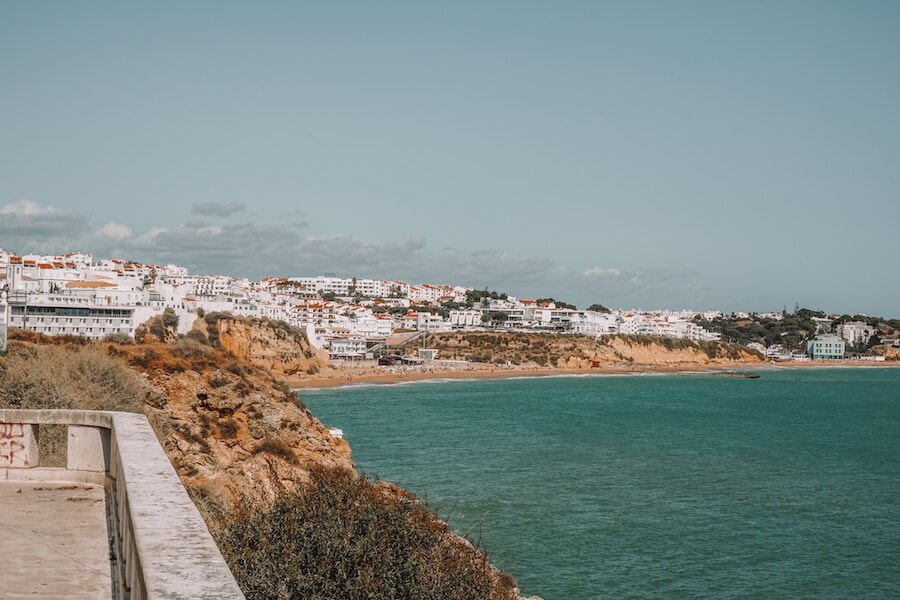 Blue water and white buildings in the distance