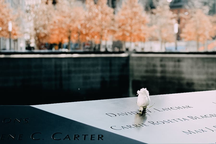 9/11 memorial showing the names engraved on the black 