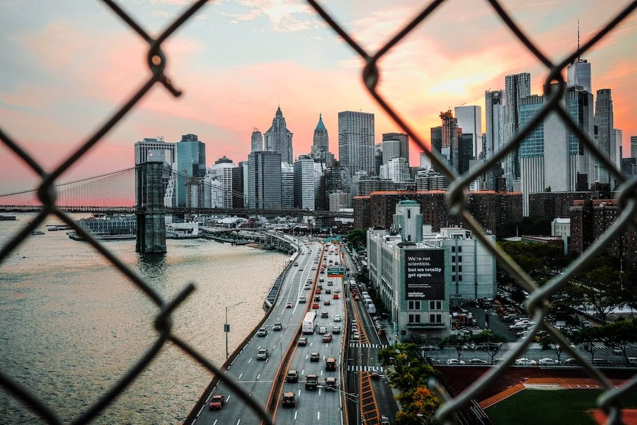 View of NYC through a chain link fence