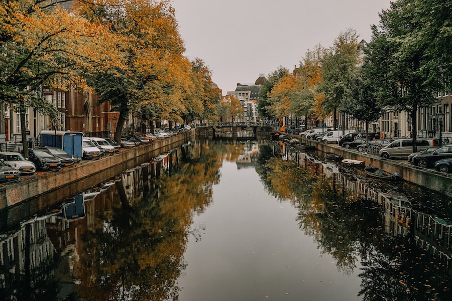 Canal with fall trees reflecting off the water