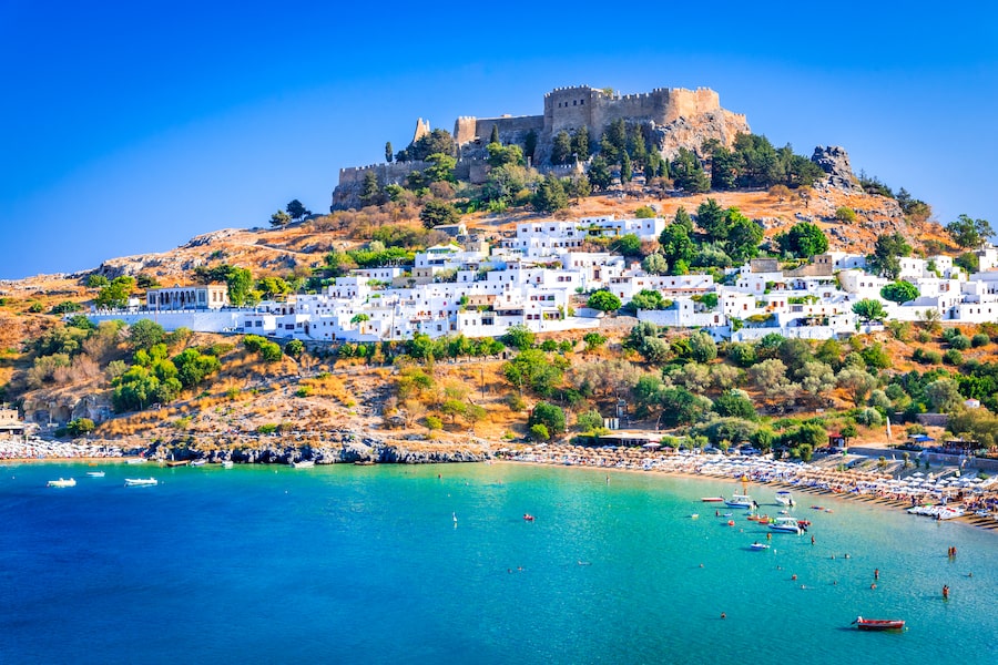 Rhodes, Greece. Lindos small whitewashed village and the Acropolis, scenery of Rhodos Island at Aegean Sea.