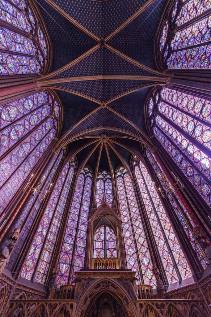 Huge stain glass windows in purple and other colours in one of the most beautiful churches in Paris 