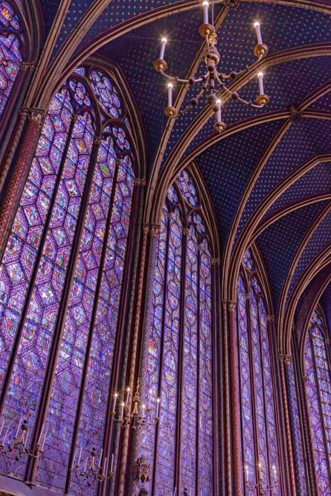 Huge stain glass windows in purple and other colours in one of the most beautiful churches in Paris 