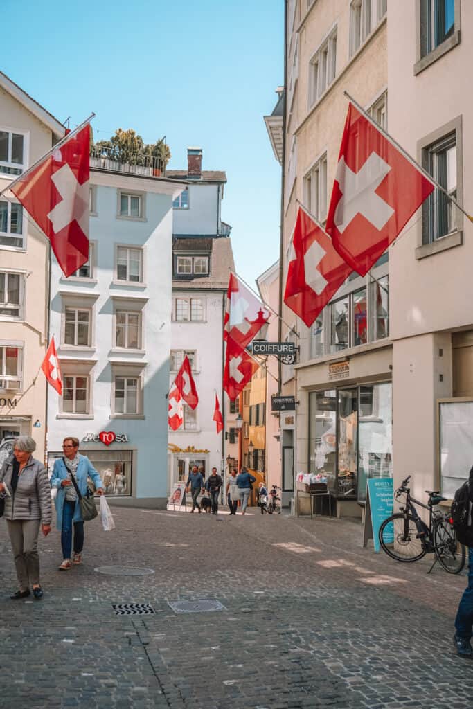 Street in Zurich with many Swiss flags