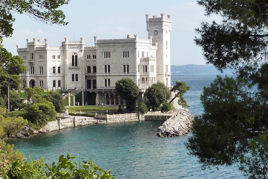 White stone castle along the water