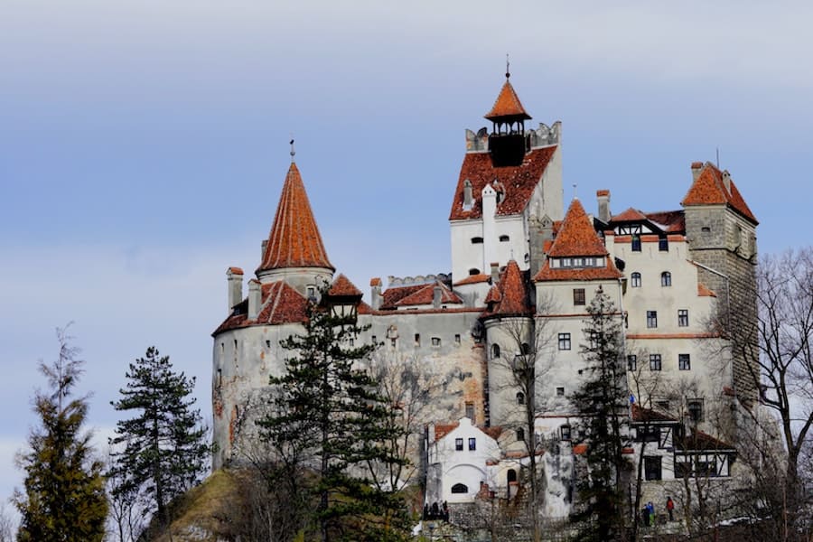 Stone castle with orange roofs