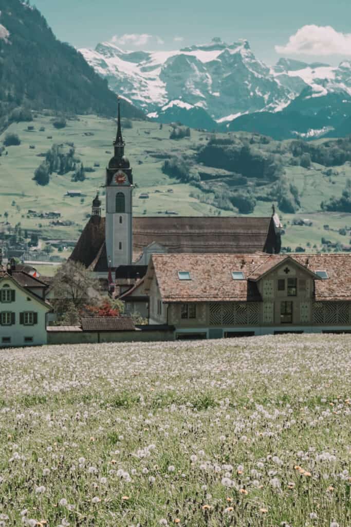 Village church with mountains in distance