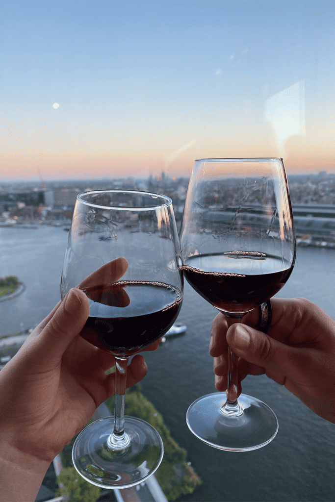 Two people drinking red wine during a date in Amsterdam