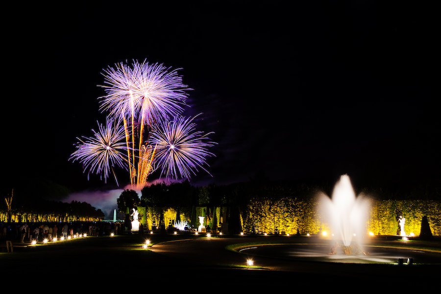 VERSAILLES - AUGUST 3 : Chateau de Versailles Gardens at night on August 3, 2013 in Versailles. The Versailles Castle was built by Louis. Every Saturday evening in Summer there is a fireworks show
