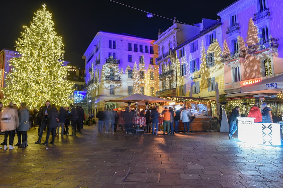Lugano, Switzerland - 11 December 2019: people shopping on the christmas market in the central square of Lugano, Switzerland