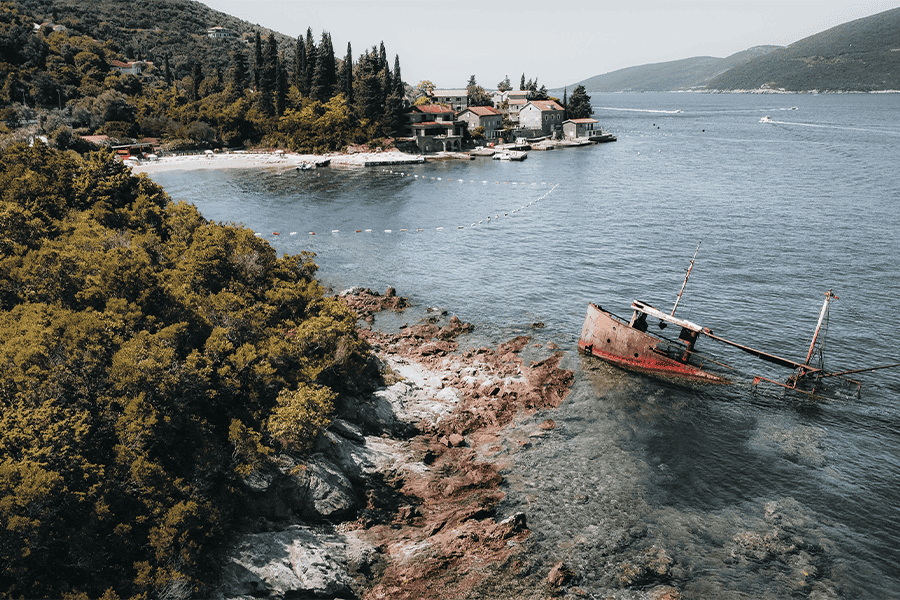Drone shot from a shipwreck and beach in Rose, Montenegro. 