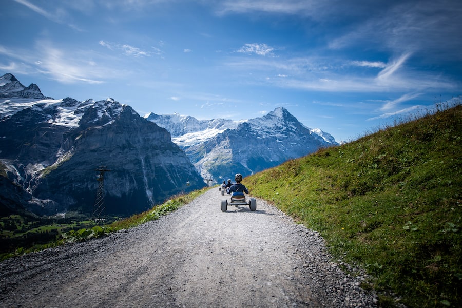 the cart riding along the extraordinary view of Switzerland mountain with the slow-motion capture