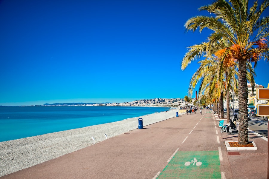 Promenade des Anglais in Nice, France. Nice is a popular Mediterranean tourist destination, attracting 4 million visitors each year.
