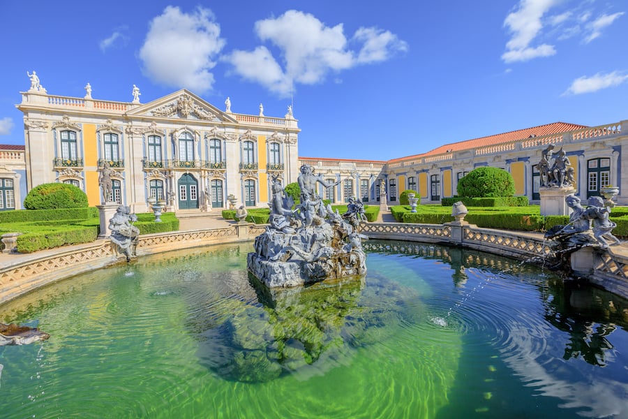 Baroque facade of Queluz National Palace and Neptune Fountain in Sintra, Lisbon district. Defined as the Versailles of Portugal, the Royal Palace of Queluz was used as a fun place for the royal family