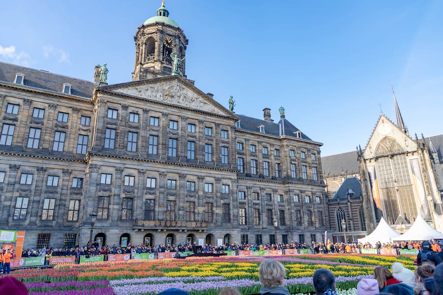 AMSTERDAM, THE NETHERLANDS - January 19, 2019: The Dutch tulip season officially in January every year as the National Tulip Day at Dam Square., Everyone is invited to pick their own tulip for free.
