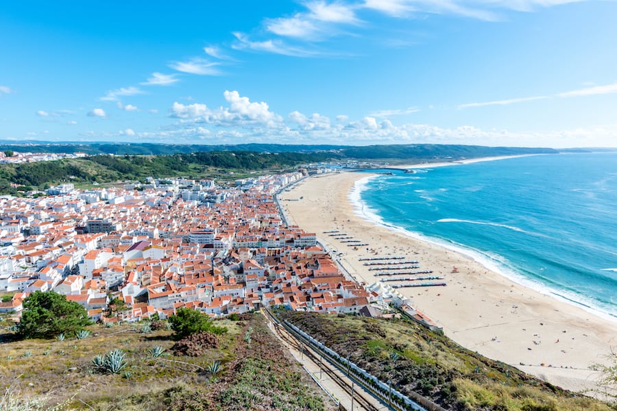 Nazare, Portugal : Beach in Nazare, a surfing paradise town - Nazare, Portugal