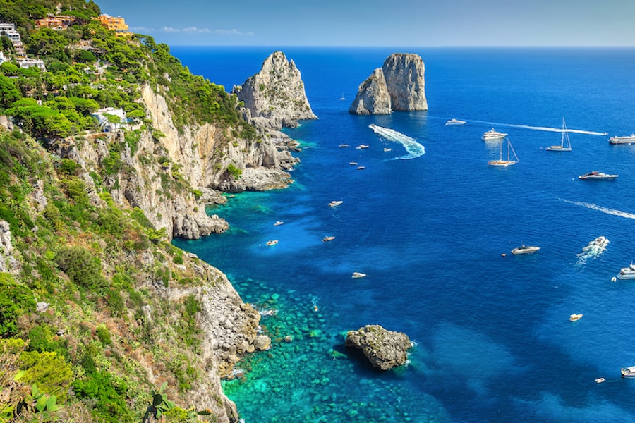 Amazing Faraglioni cliffs panorama with the majestic Tyrrhenian sea in background, Capri island, Campania region, Italy, Europe