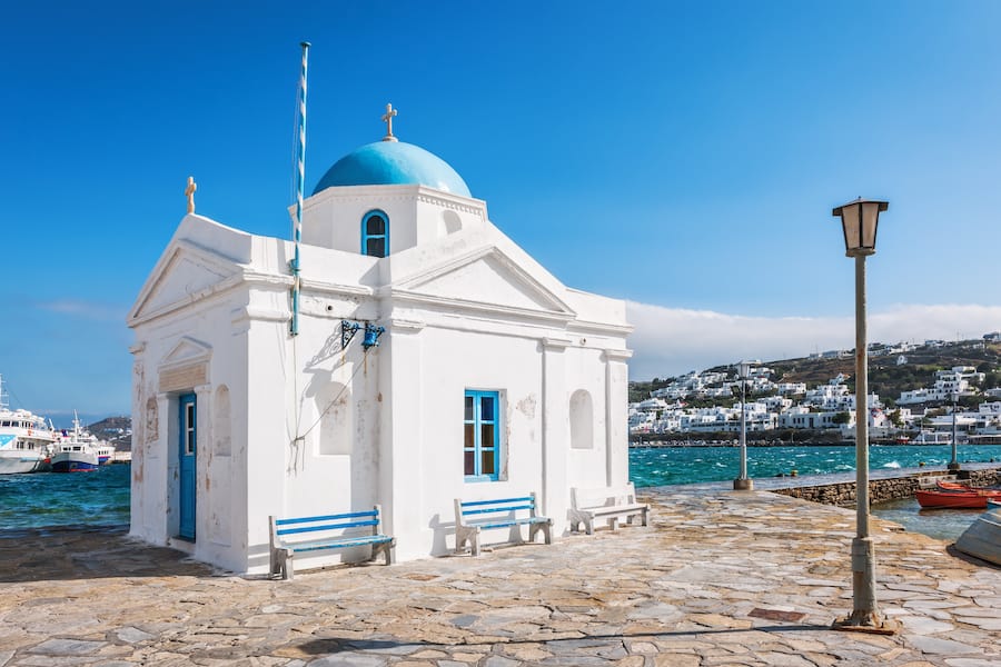 Whitewashed and blue domed Agios Nikolaos church in Mykonos, Greece, Europe