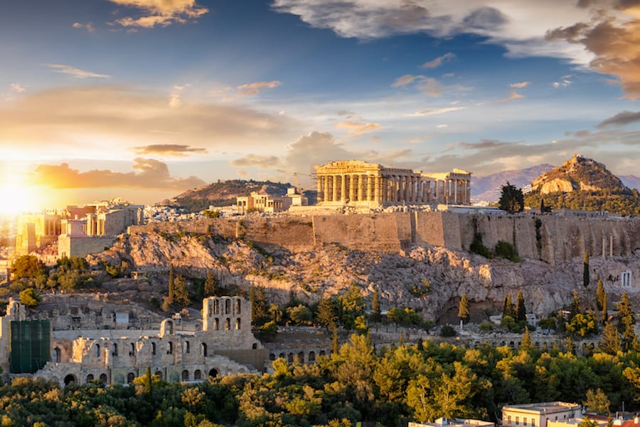 The Acropolis of Athens, Greece, with the Parthenon Temple on top of the hill during a summer sunset