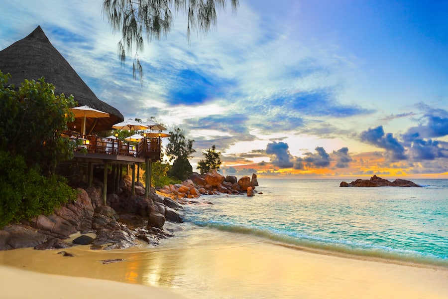 Cafe on tropical beach at sunset - nature background