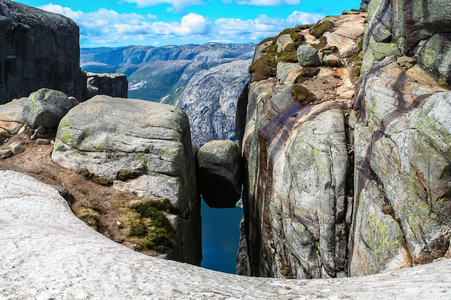 Close view of the famous boulder Kjeragbolten above the Lysefjorden on the mountain Kjerag in Forsand municipality in Rogaland county, Norway.