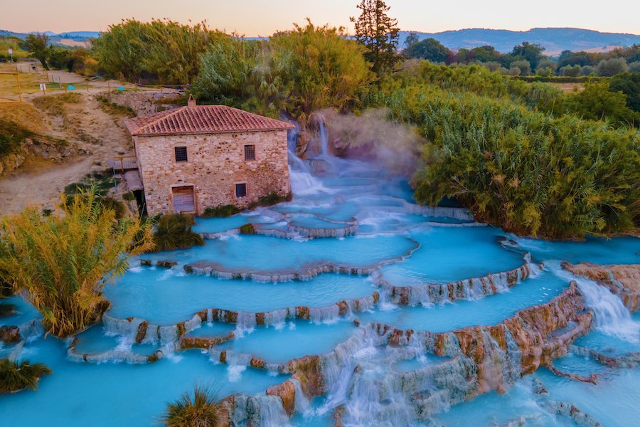 natural spa with waterfalls and hot springs at Saturnia thermal baths, Grosseto, Tuscany, Italy,Hot springs Cascate del Mulino with old watermill, Saturnia, Grosseto, Tuscany, Italy. High quality