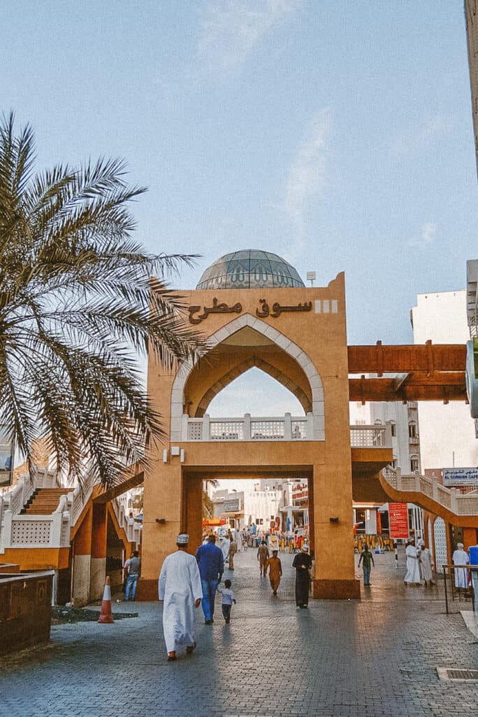 Locals and tourists visit the Mutrah souk (souq), to shop in the attractive waterfront Corniche area, the entrance is a domed, double-height gateway with arches.