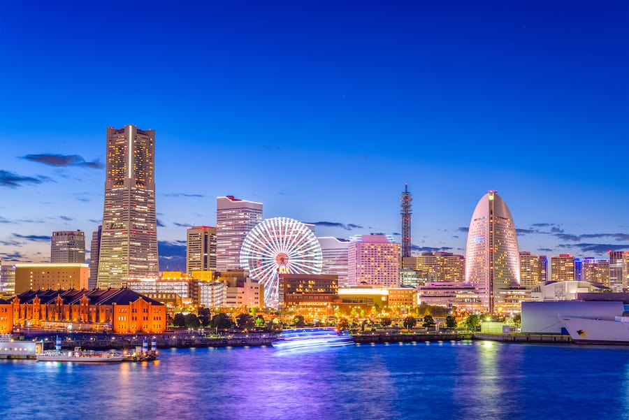 Yokohama, Japan city skyline from the bay at twilight.