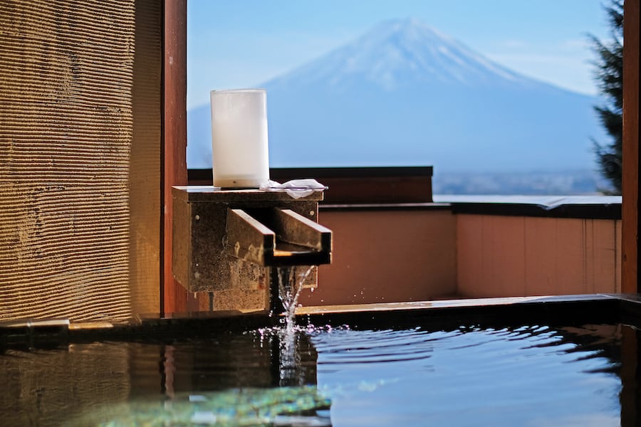 Outdoor hot-spring bath with the beautiful view of Mountain Fuji and Lake Kawaguchiko in Japan