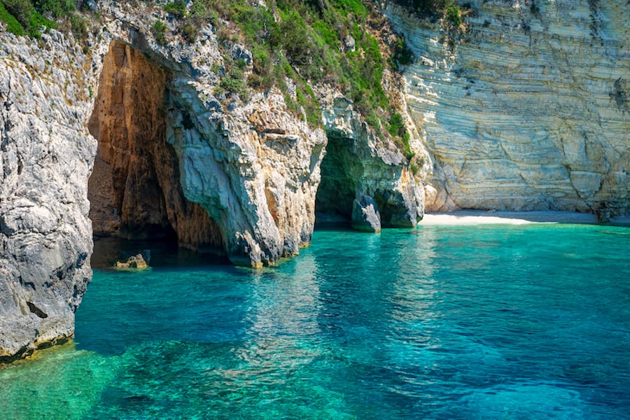 Amazing landscape. The Blue Cave: three exceptional sea caves which are communicating each other. They owe their name to the variety of shades of blue and to the clear waters. Paxos island. Greece.