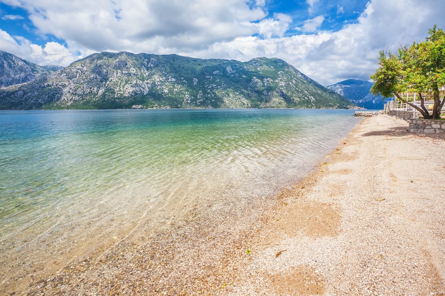Morning beach with sea and mountain views.  Montenegro