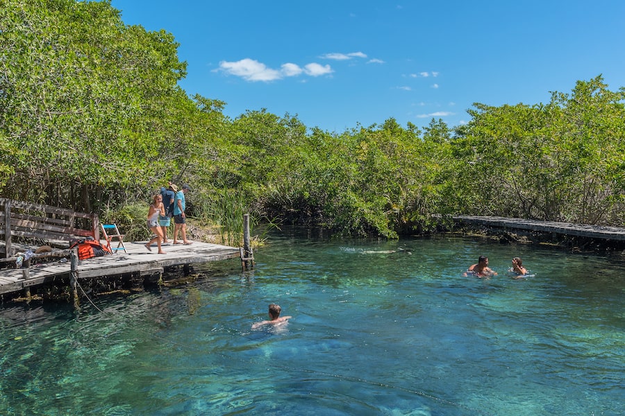 Tourists swim at the Hoyo negro Yalahau water hole, Isla Holbox, Mexico