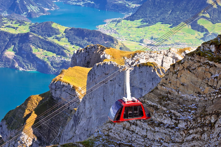 Mount Pilatus aerial cabelway above cliffs and Lake Lucerne landscape, Switzerland