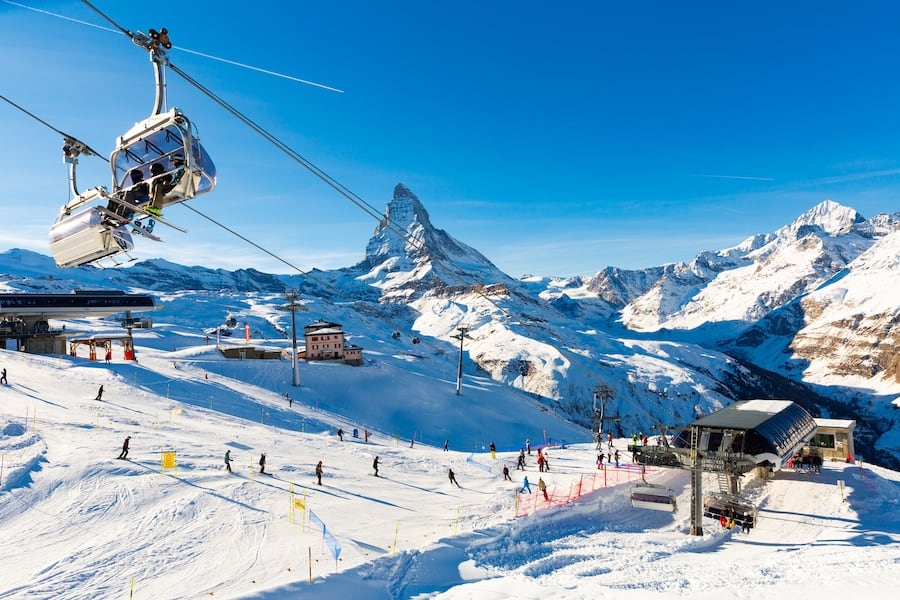ZERMATT, SWITZERLAND - JANUARY 01, 2022: Zermatt ski resort with view on the mountain Matterhorn, Alps